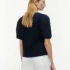 Bluză cu ochiuri brodate și materiale mixte Bluză cu ochiuri brodate și materiale mixte