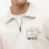 Hanorac polo cu logo floral și fermoar pe un sfert Hanorac polo cu logo floral și fermoar pe un sfert