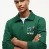 Hanorac polo cu logo floral și fermoar pe un sfert Hanorac polo cu logo floral și fermoar pe un sfert