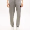Pantaloni de trening cu dungi caracteristice Pantaloni de trening cu dungi caracteristice