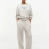 Pantaloni de trening din material froté cu logo script relaxat Pantaloni de trening din material froté cu logo script relaxat