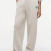 Pantaloni de trening din material froté cu logo script relaxat Pantaloni de trening din material froté cu logo script relaxat