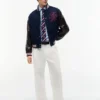 Pantaloni largi cu pliuri, cu textură de hârtie Pantaloni largi cu pliuri, cu textură de hârtie
