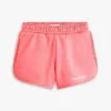 Pantaloni scurți cu logo Tommy cu sclipici pentru copii Pantaloni scurți cu logo Tommy cu sclipici pentru copii