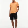 Polo Tommy cu croială regular și material elastic