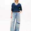 Pulover Tommy Jeans cu croială lejeră și guler în V Pulover Tommy Jeans cu croială lejeră și guler în V