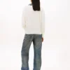 Pulover Tommy Jeans cu croială lejeră și guler în V Pulover Tommy Jeans cu croială lejeră și guler în V