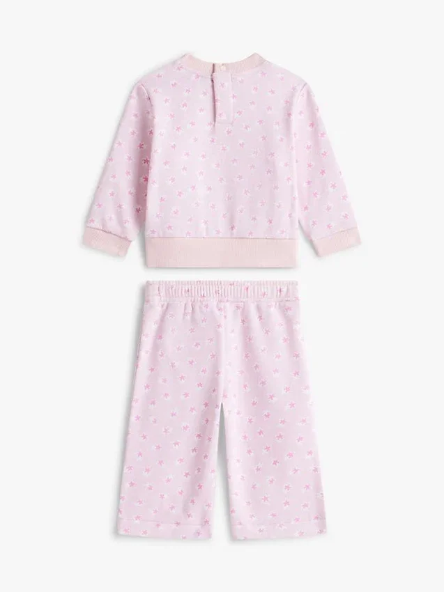 Set pentru bebeluși cu bluză cu stele și pantaloni cu croi larg Set pentru bebeluși cu bluză cu stele și pantaloni cu croi larg