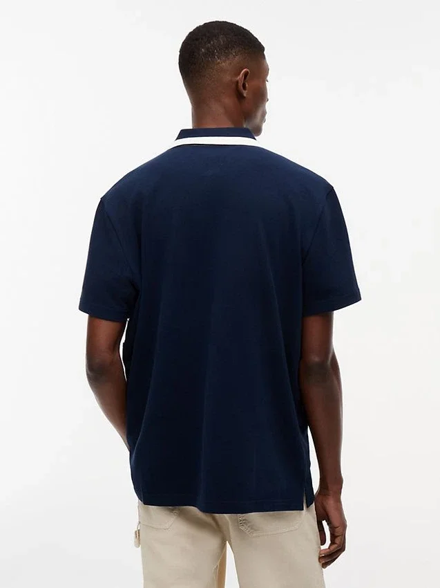 Tommy Jeans Polo relaxat cu fermoar pe un sfert Tommy Jeans Polo relaxat cu fermoar pe un sfert