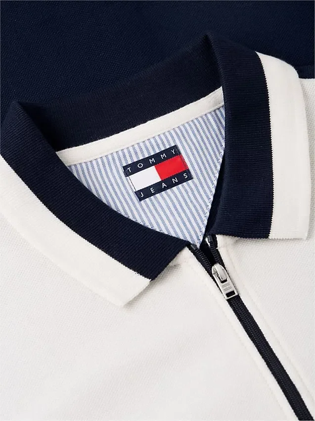 Tommy Jeans Polo relaxat cu fermoar pe un sfert Tommy Jeans Polo relaxat cu fermoar pe un sfert